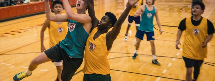 group of people playing basketball