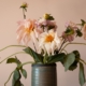 pink and white flowers in blue ceramic vase