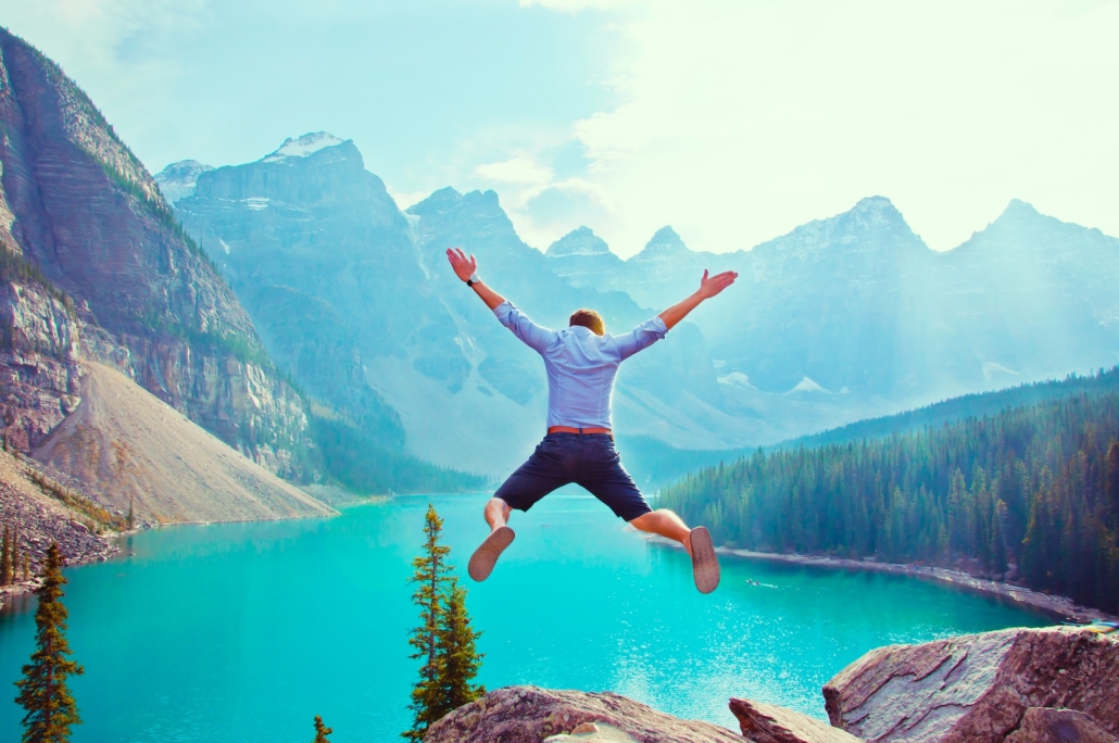 photo of man about to jump from cliff