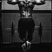 grayscale photo of man working out