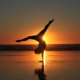 woman in white dress standing on beach during sunset